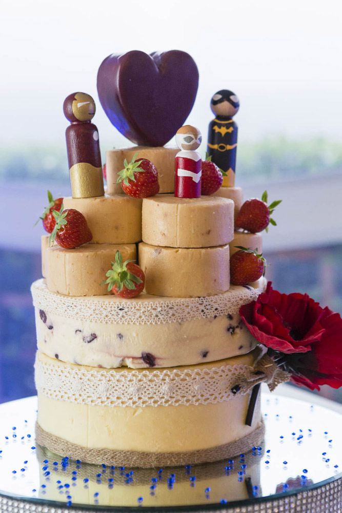 The superhero-themed wedding cake steals the show with its intricate design and vibrant colors.