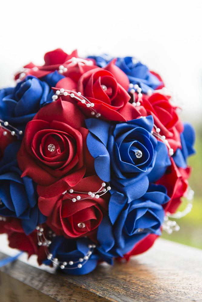 The bridal bouquet features vibrant reds and blues, echoing the colors of the Marvel universe