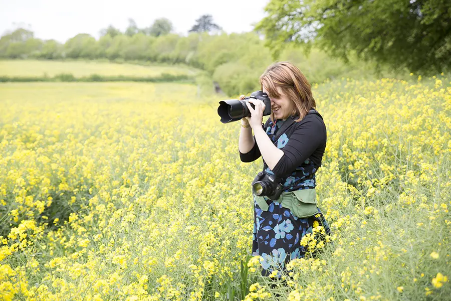 Photograph of Charlene in a stunning Monmouthshire field taking a photo
